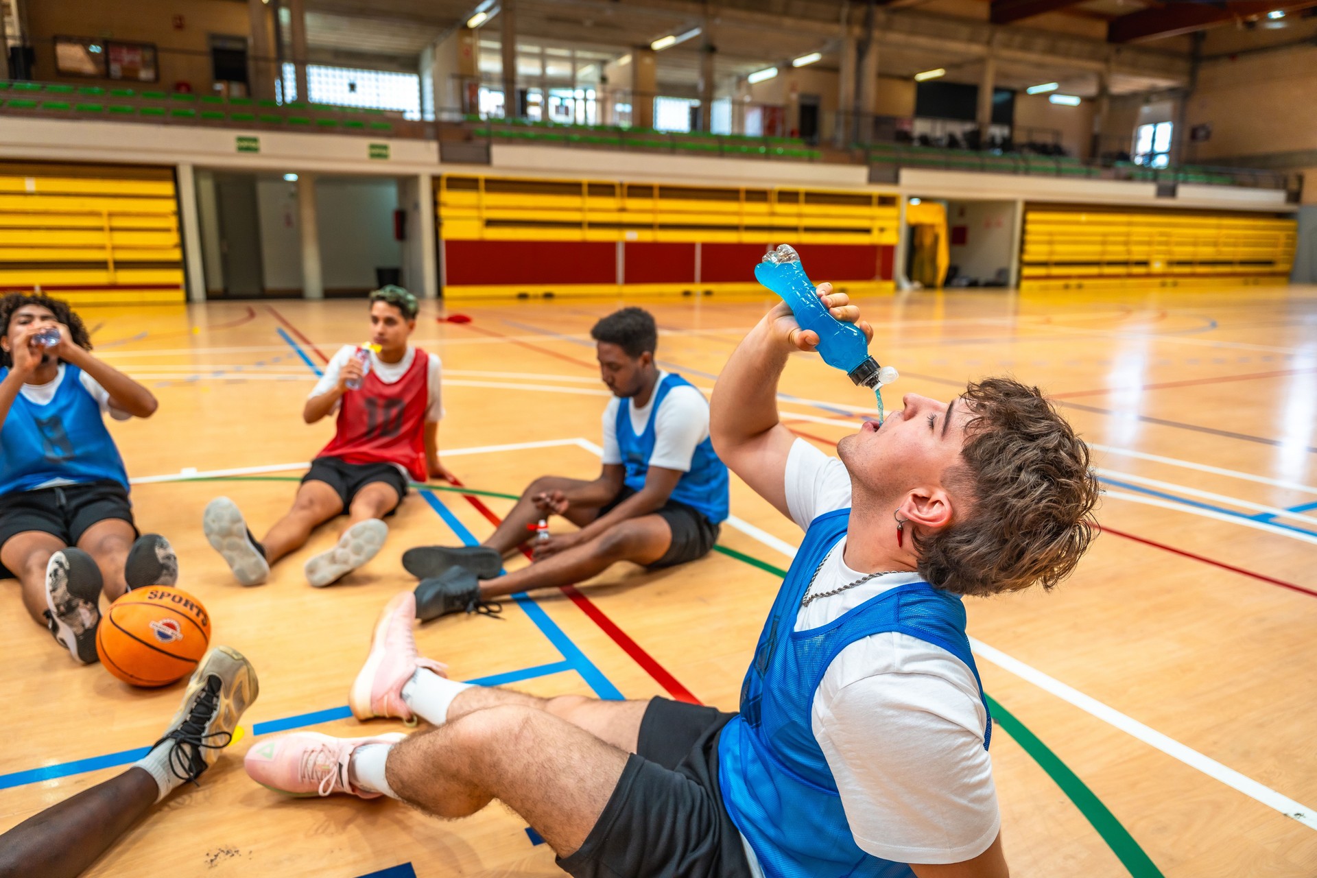 Basketball players rehydrating after training session
